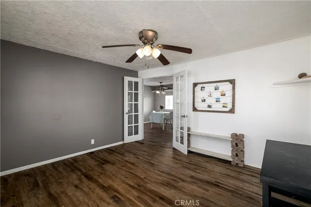 a view of livingroom with hardwood floor and ceiling fan