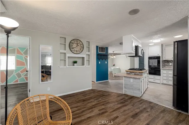 a view of kitchen with furniture and wooden floor
