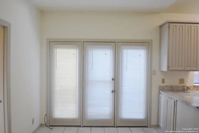 a view of cabinets and window