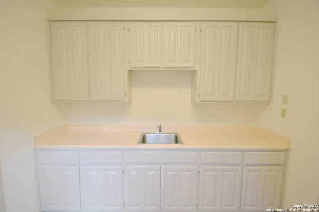 a bathroom with a sink and a vanity