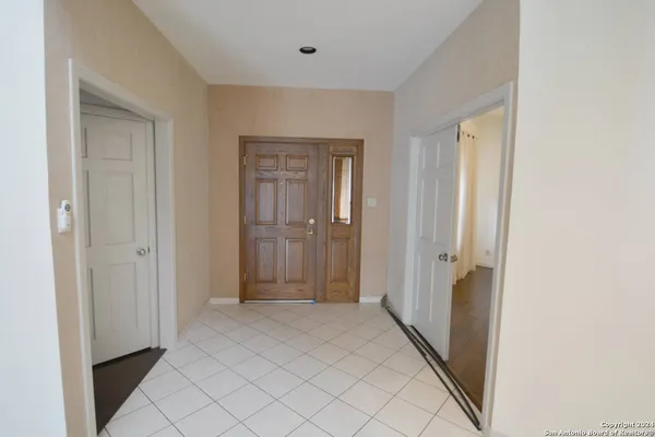 a view of a hallway with bathroom