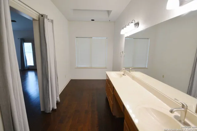 a spacious bathroom with a tub and shower