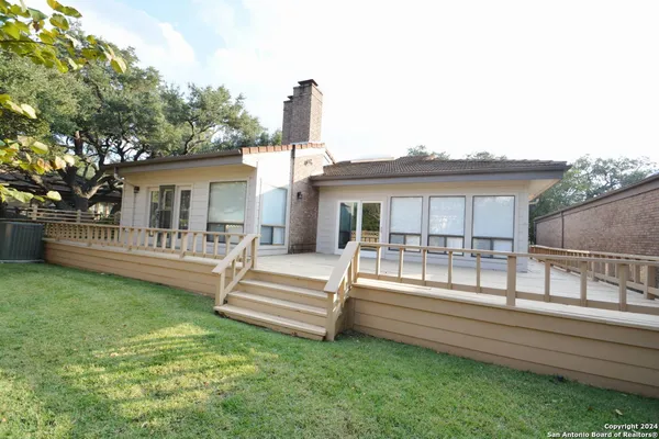 a front view of a house with a garden and porch