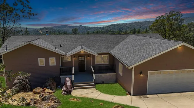 front view of a house with a yard