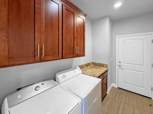 a utility room with dryer and washer