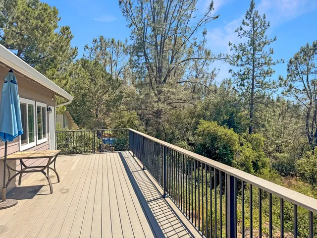 a view of balcony with furniture and wooden deck