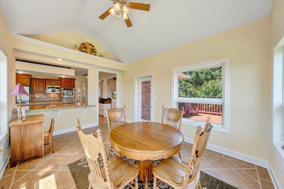 625 Frontier Way Fincastle, VA 24090 - Photo 28 of 105 a view of a dining room with furniture window and wooden floor
