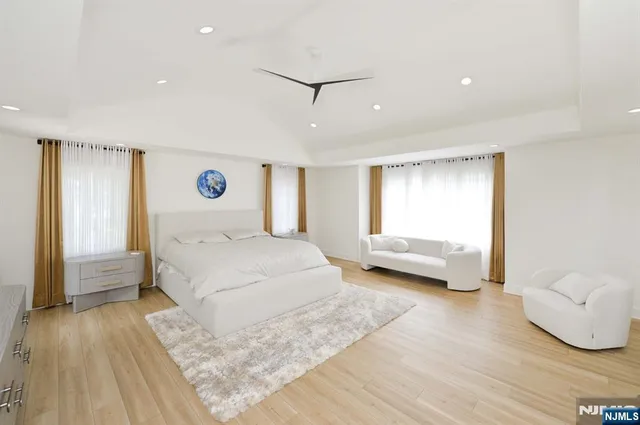 a bedroom with a bed and a couch