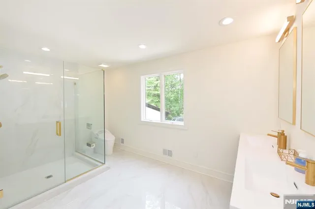 a bathroom with a bathtub and a shower