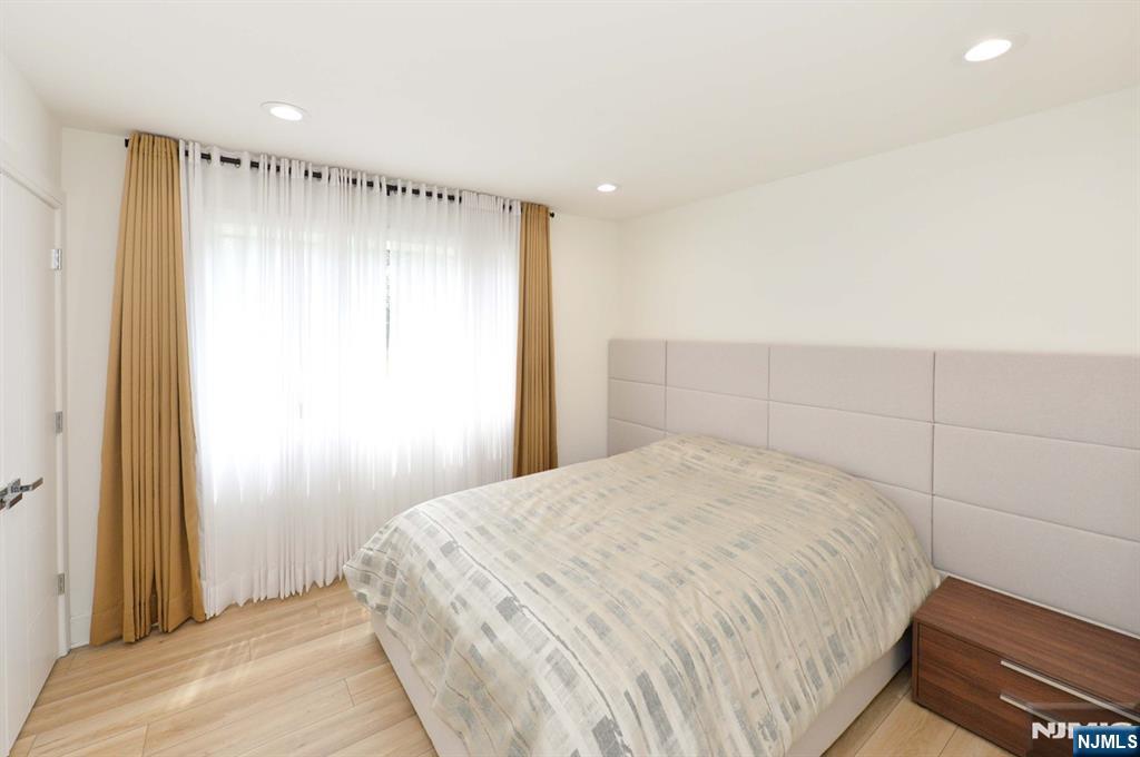 880 Briarwoods Road Franklin Lakes, NJ 07417 - Photo 17 of 27 a spacious bedroom with a bed and a shower