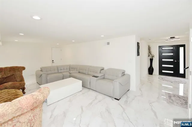 a living room with furniture and window