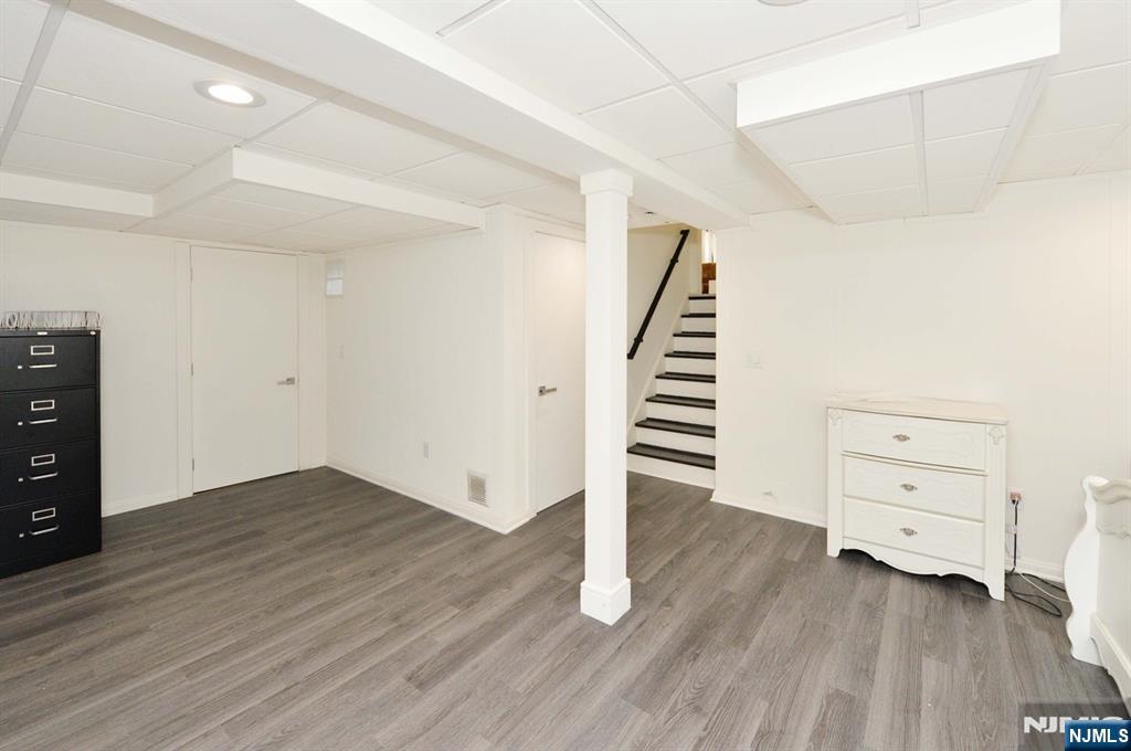 880 Briarwoods Road Franklin Lakes, NJ 07417 - Photo 23 of 27 wooden floor in an empty room with a window
