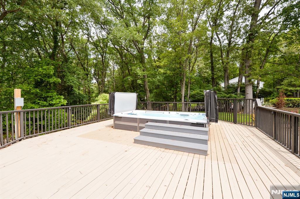 880 Briarwoods Road Franklin Lakes, NJ 07417 - Photo 25 of 27 a view of backyard with deck and wooden floor