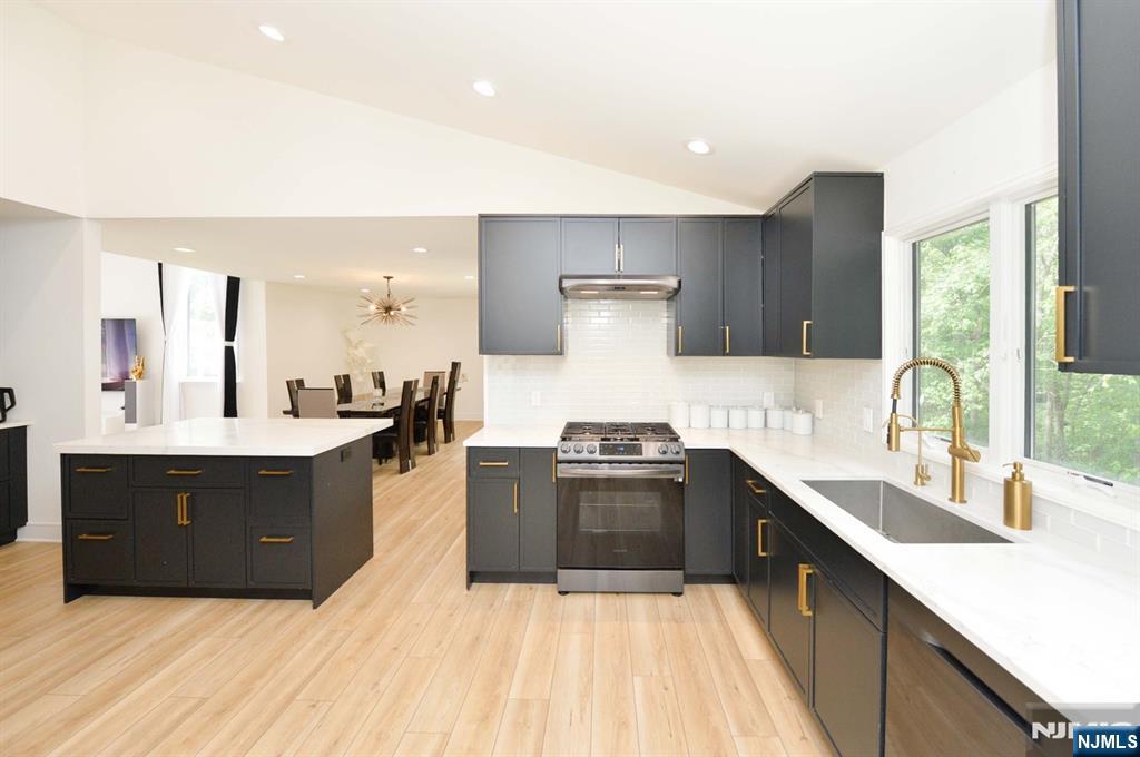 880 Briarwoods Road Franklin Lakes, NJ 07417 - Photo 6 of 27 a large kitchen with wooden cabinets