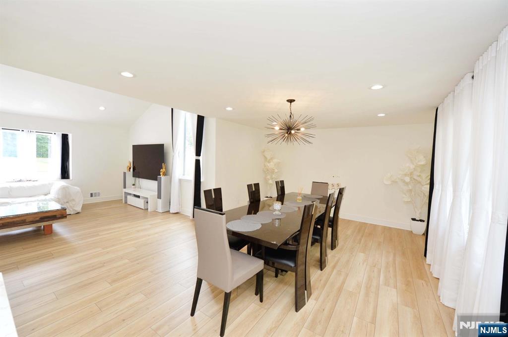 880 Briarwoods Road Franklin Lakes, NJ 07417 - Photo 10 of 27 a view of a dining room with furniture and wooden floor