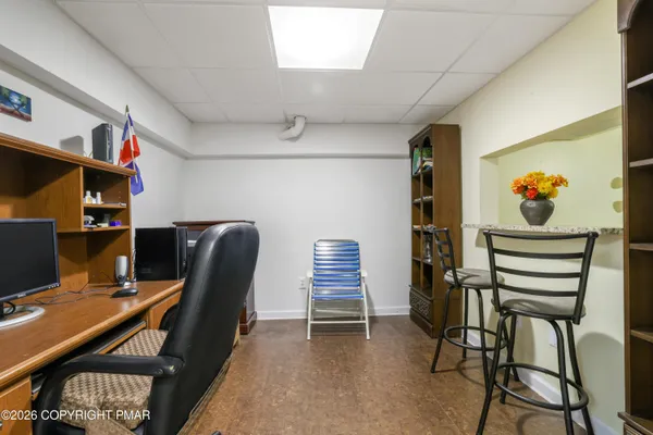 a workspace with furniture and book shelf