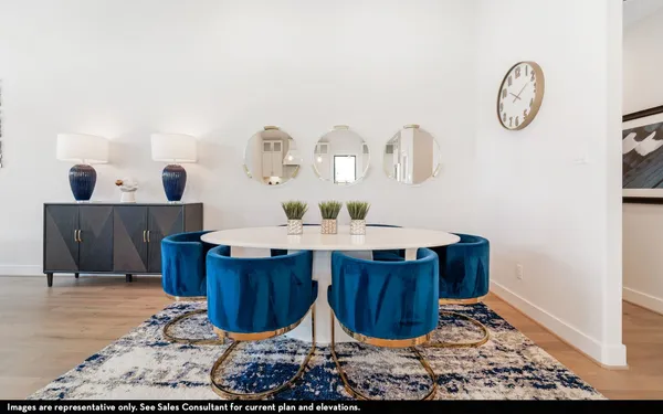 a dining room with table and chairs
