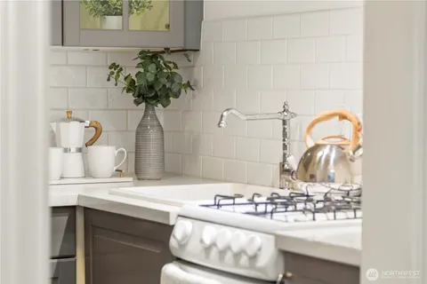 a bathroom with a sink a mirror and a shower
