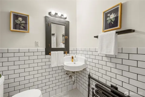 a white bath tub sitting next to a white sink