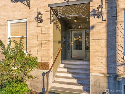a front view of a house with plants