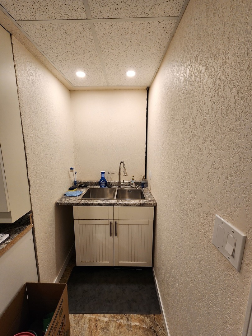 1504 Marshland Way, Unit BASMENT Bull Valley, IL 60098 - Photo 15 of 16 a kitchen with sink and window