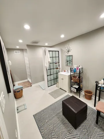 a room with furniture a flat screen tv and a table