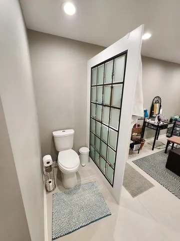 a bathroom with a toilet and a sink
