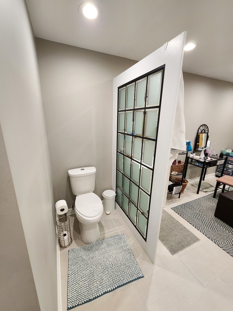 1504 Marshland Way, Unit BASMENT Bull Valley, IL 60098 - Photo 5 of 16 a bathroom with a toilet and a sink