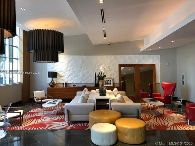 a kitchen with a table chairs stove and kitchen view