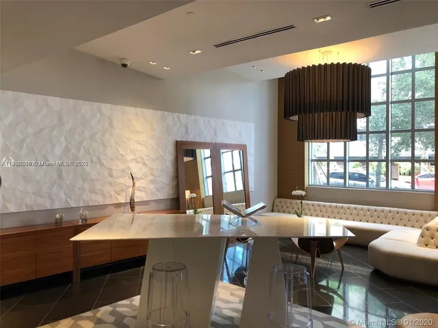 a view of a fountain in front of a house with a fountain