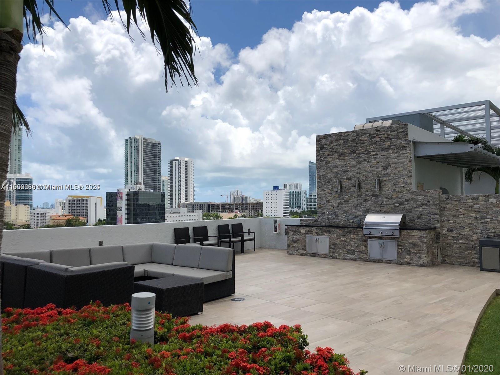3301 Northeast 1st Avenue, Unit H1806 Miami, FL 33137 - Photo 20 of 22 a terrace with outdoor seating and barbeque oven
