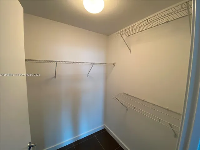 a view of an empty room with windows