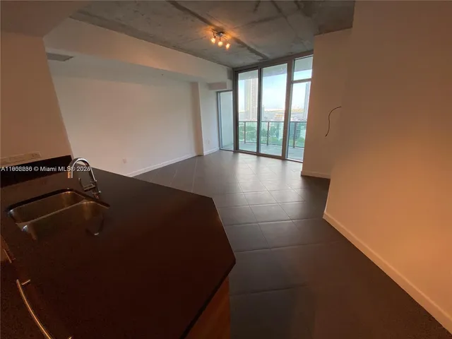 a room with cabinets and wooden floor