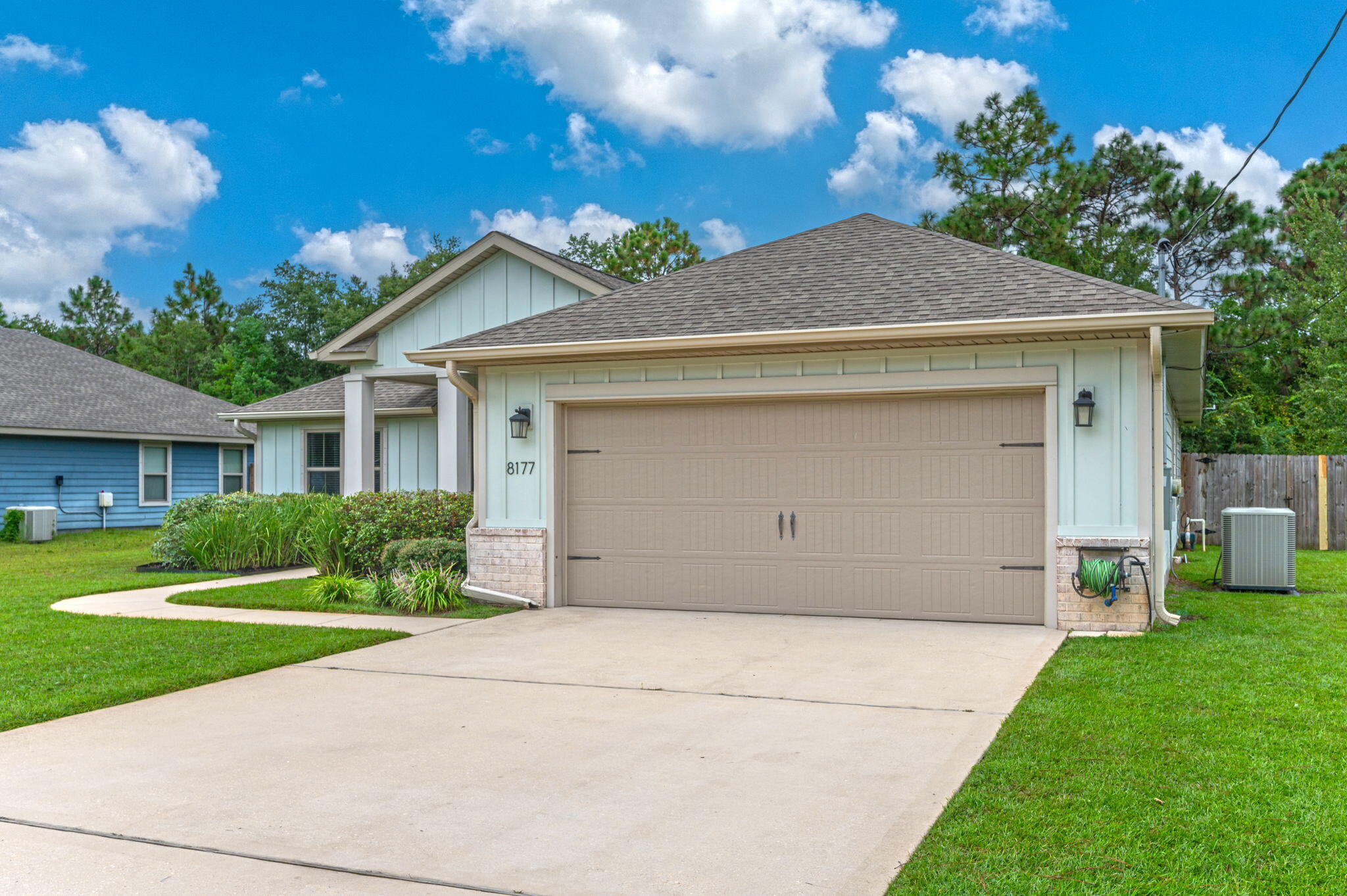 8177 Lucena Street Navarre, FL 32566 - Photo 2 of 51 a view of a house with a yard