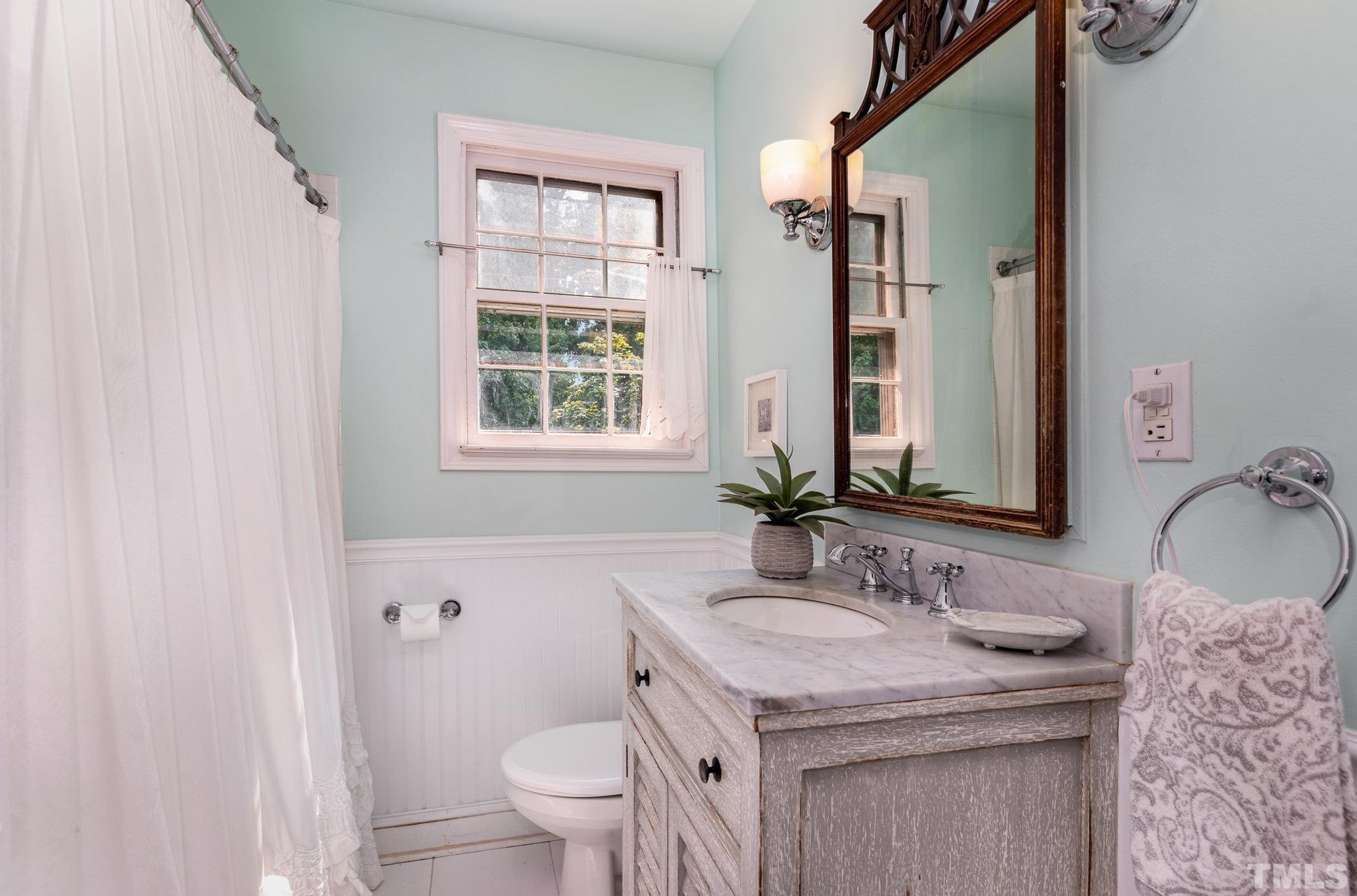 1200 Mitchell Street Raleigh, NC 27607 - Photo 13 of 31 a bathroom with a granite countertop sink toilet and shower