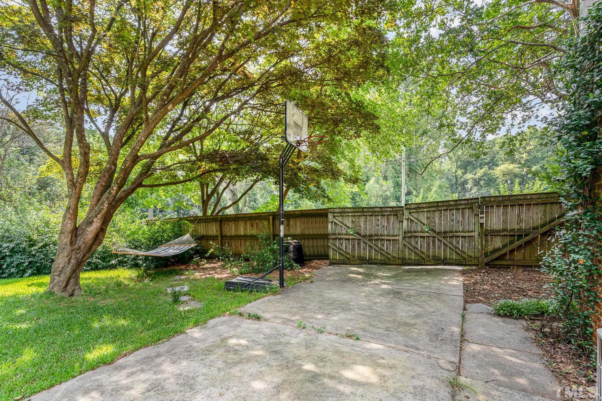 1200 Mitchell Street Raleigh, NC 27607 - Photo 23 of 31 a view of garden with wooden fence