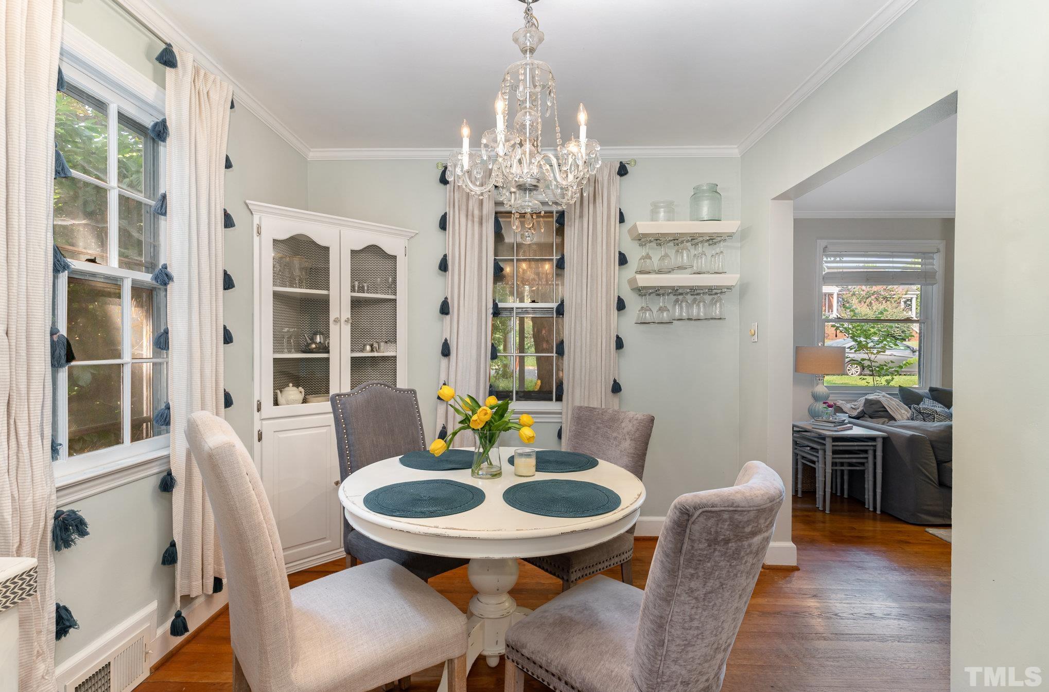 1200 Mitchell Street Raleigh, NC 27607 - Photo 8 of 31 a view of a dining room with furniture window and wooden floor