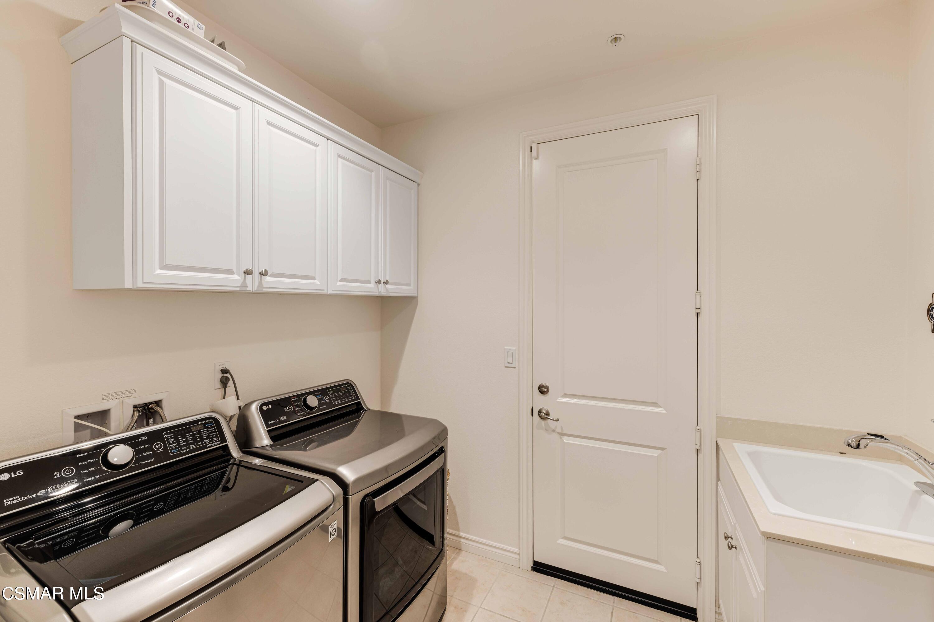13210 Bent Grass Place Moorpark, CA 93021 - Photo 18 of 73 a view of a storage and utility room with washer and dryer