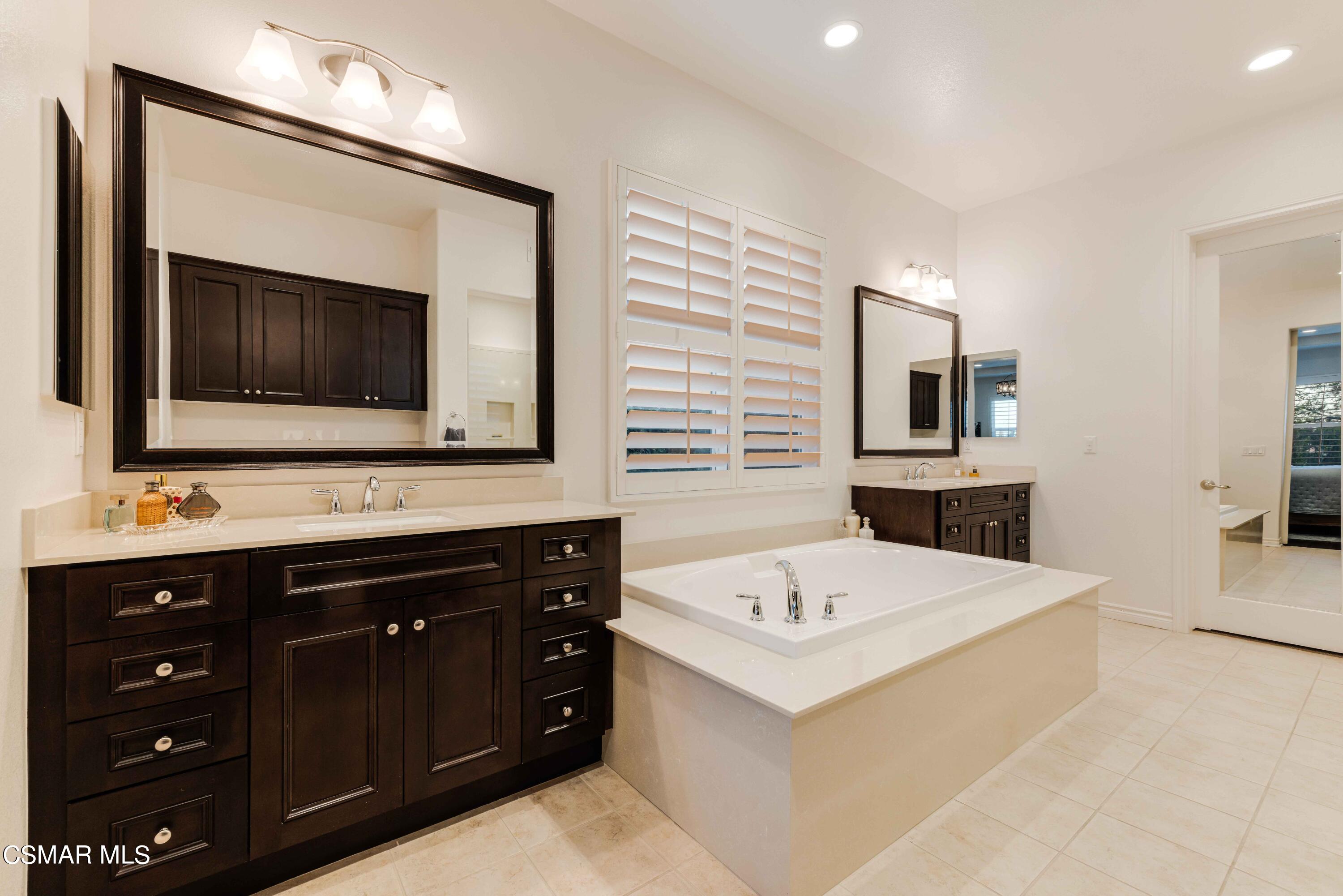 13210 Bent Grass Place Moorpark, CA 93021 - Photo 22 of 73 a bathroom with a sink and a mirror