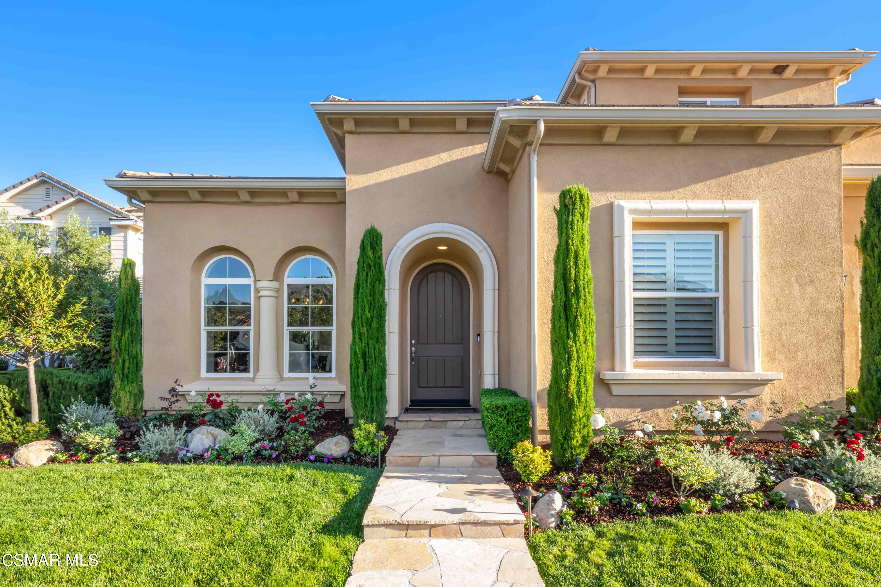13210 Bent Grass Place Moorpark, CA 93021 - Photo 3 of 73 a front view of a house with garden