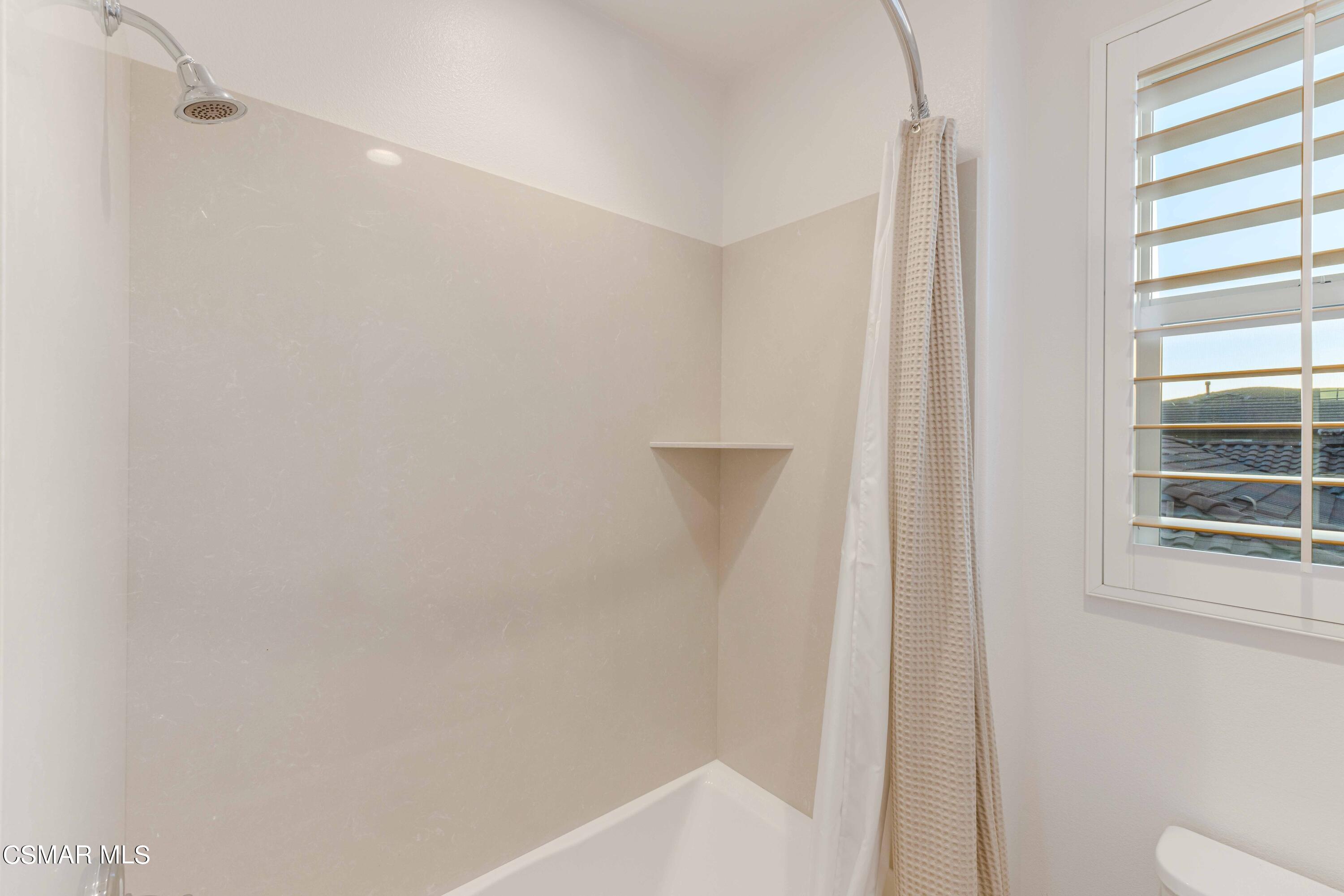 13210 Bent Grass Place Moorpark, CA 93021 - Photo 31 of 73 a bathroom with a shower and a toilet