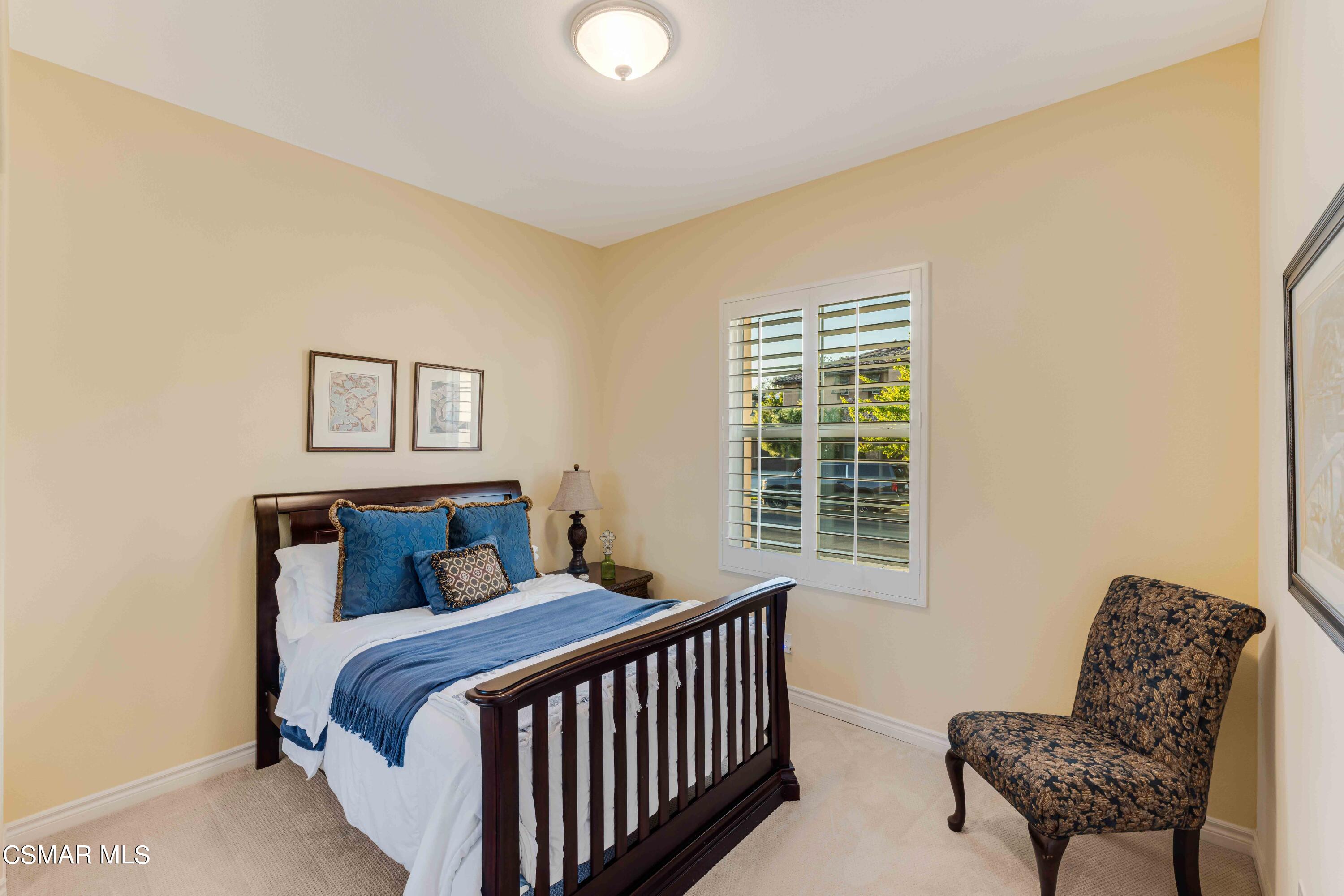 13210 Bent Grass Place Moorpark, CA 93021 - Photo 36 of 73 a bedroom with a bed and a couch