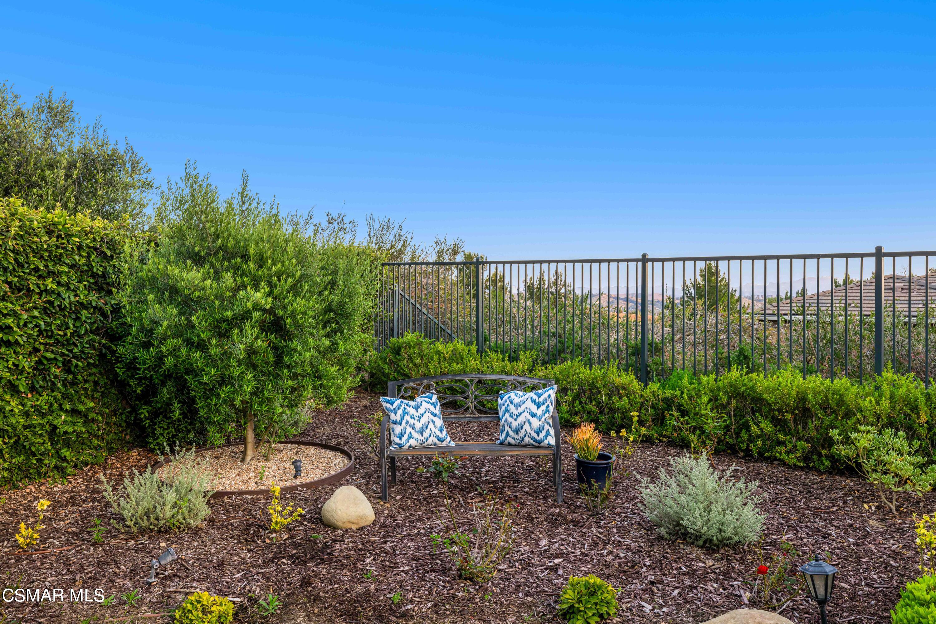 13210 Bent Grass Place Moorpark, CA 93021 - Photo 40 of 73 a view of a backyard with plants and outdoor seating