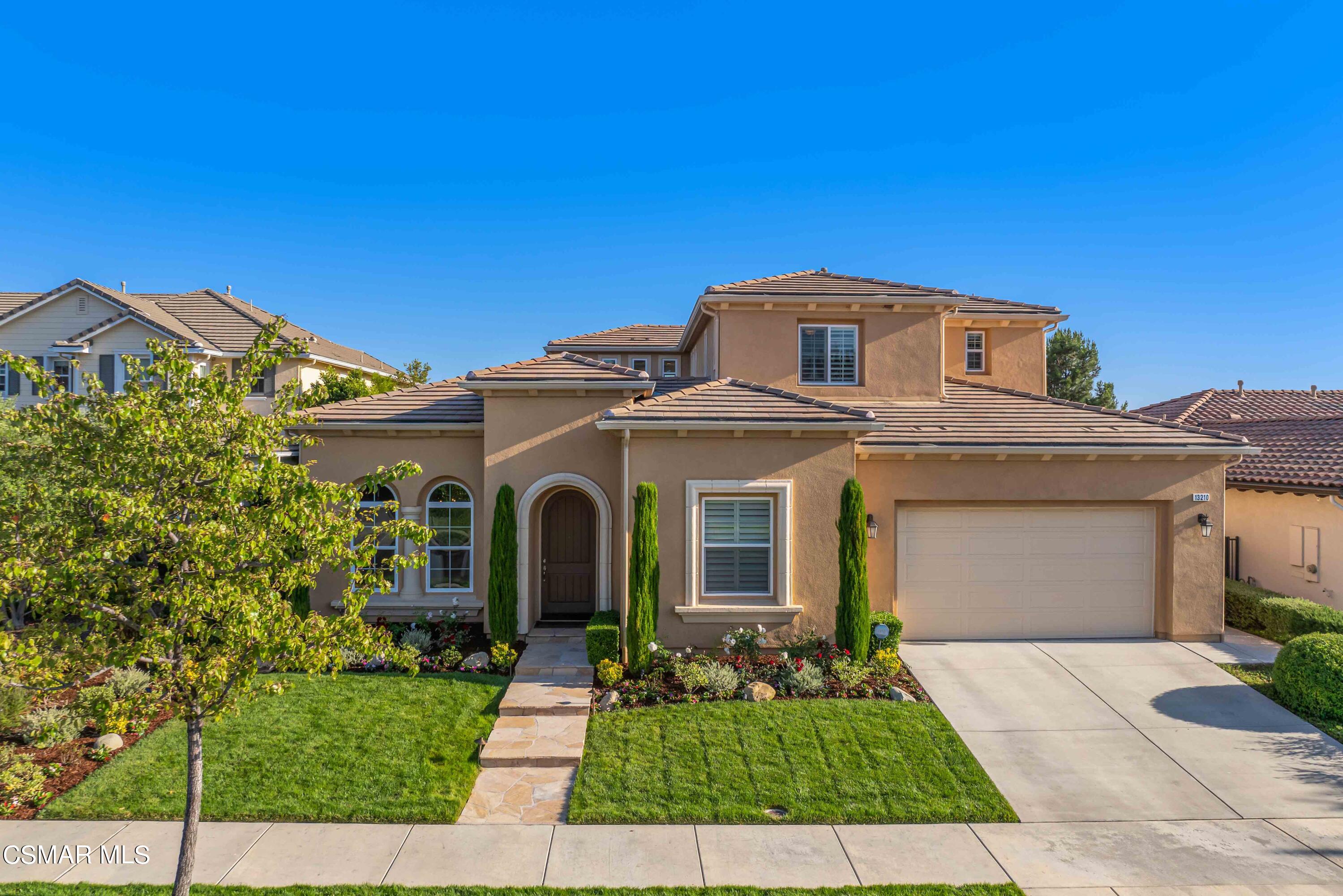 13210 Bent Grass Place Moorpark, CA 93021 - Photo 47 of 73 a front view of a house with a yard