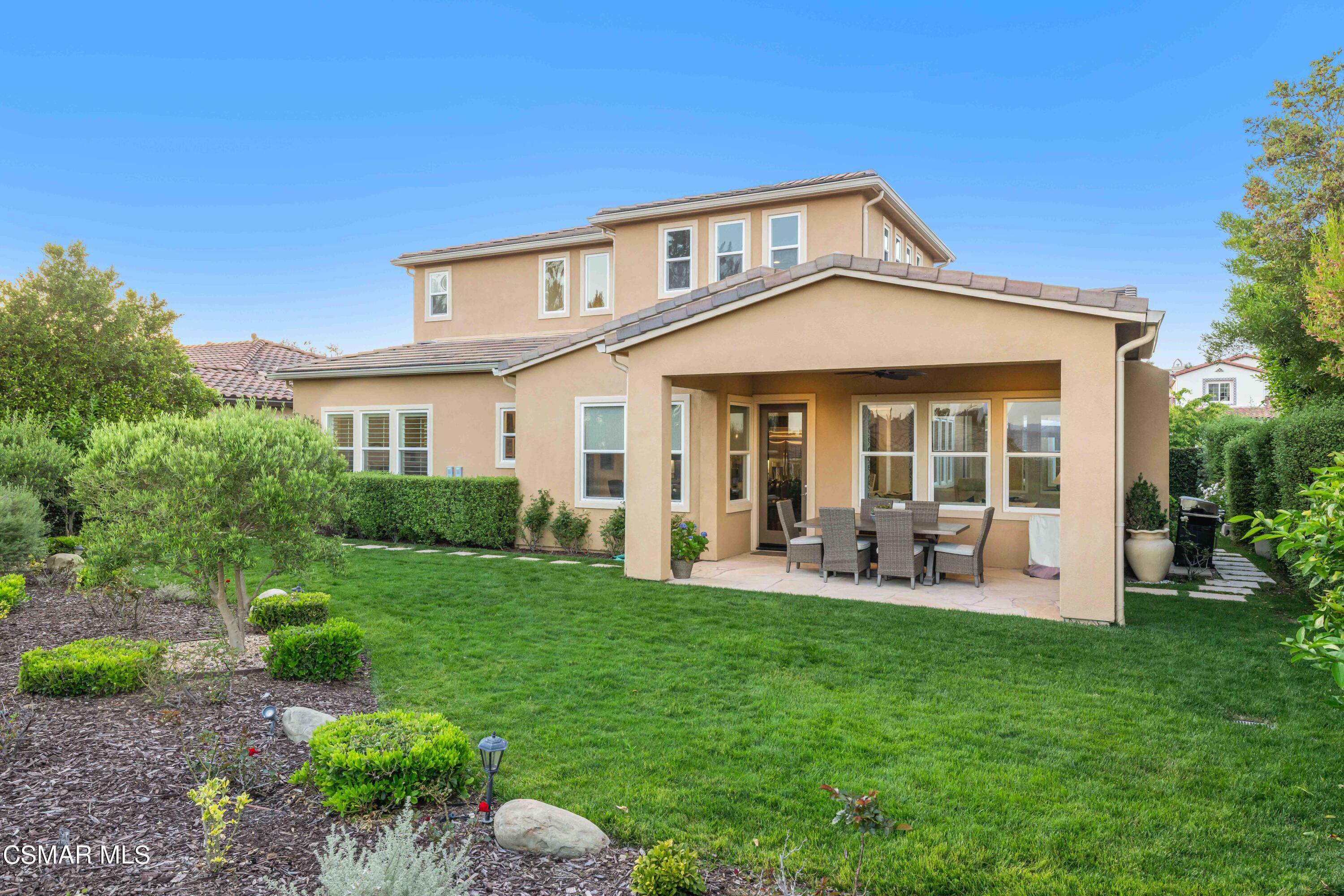 13210 Bent Grass Place Moorpark, CA 93021 - Photo 48 of 73 a front view of a house with garden and porch