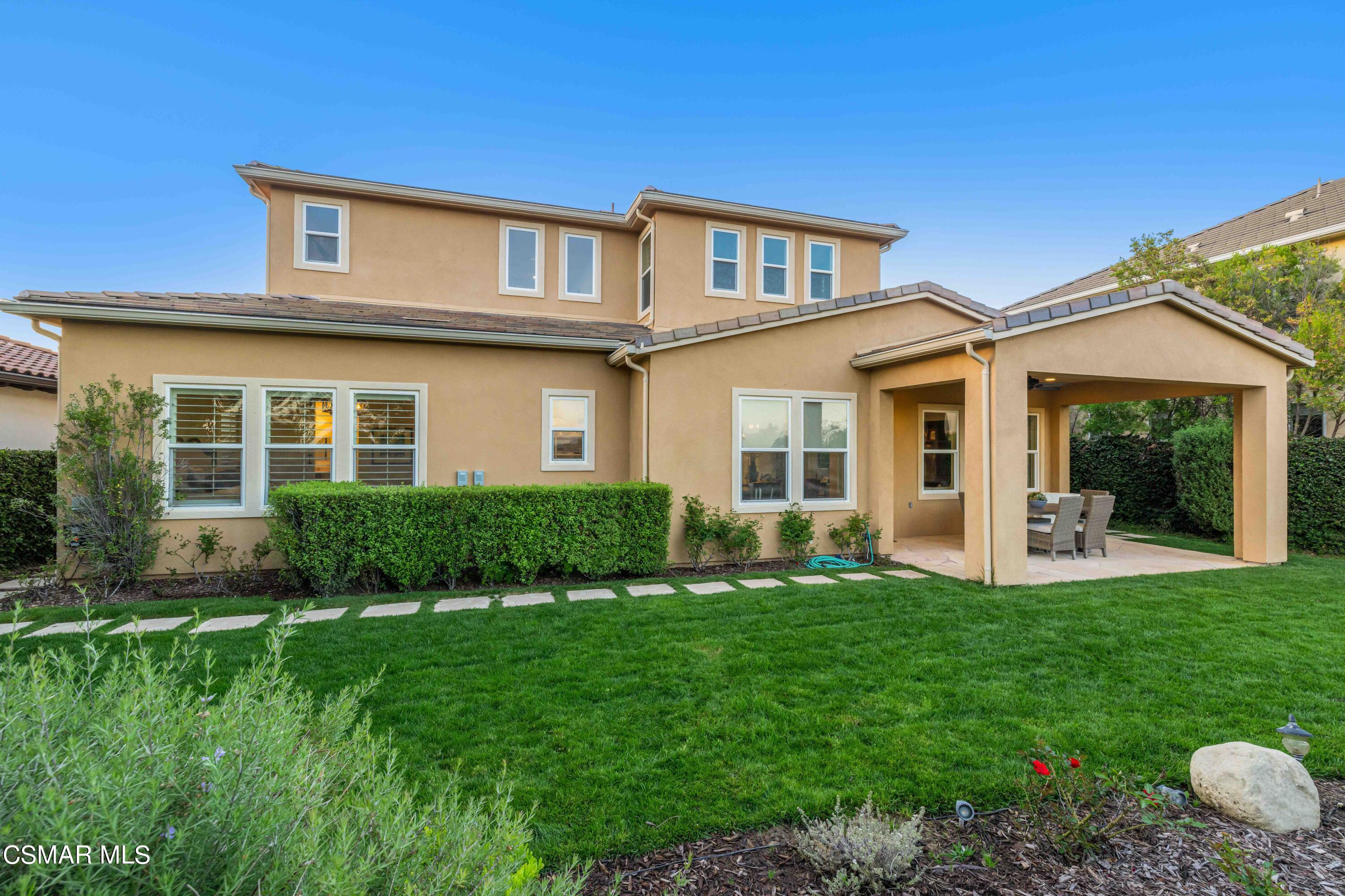 13210 Bent Grass Place Moorpark, CA 93021 - Photo 49 of 73 a front view of a house with a yard and porch