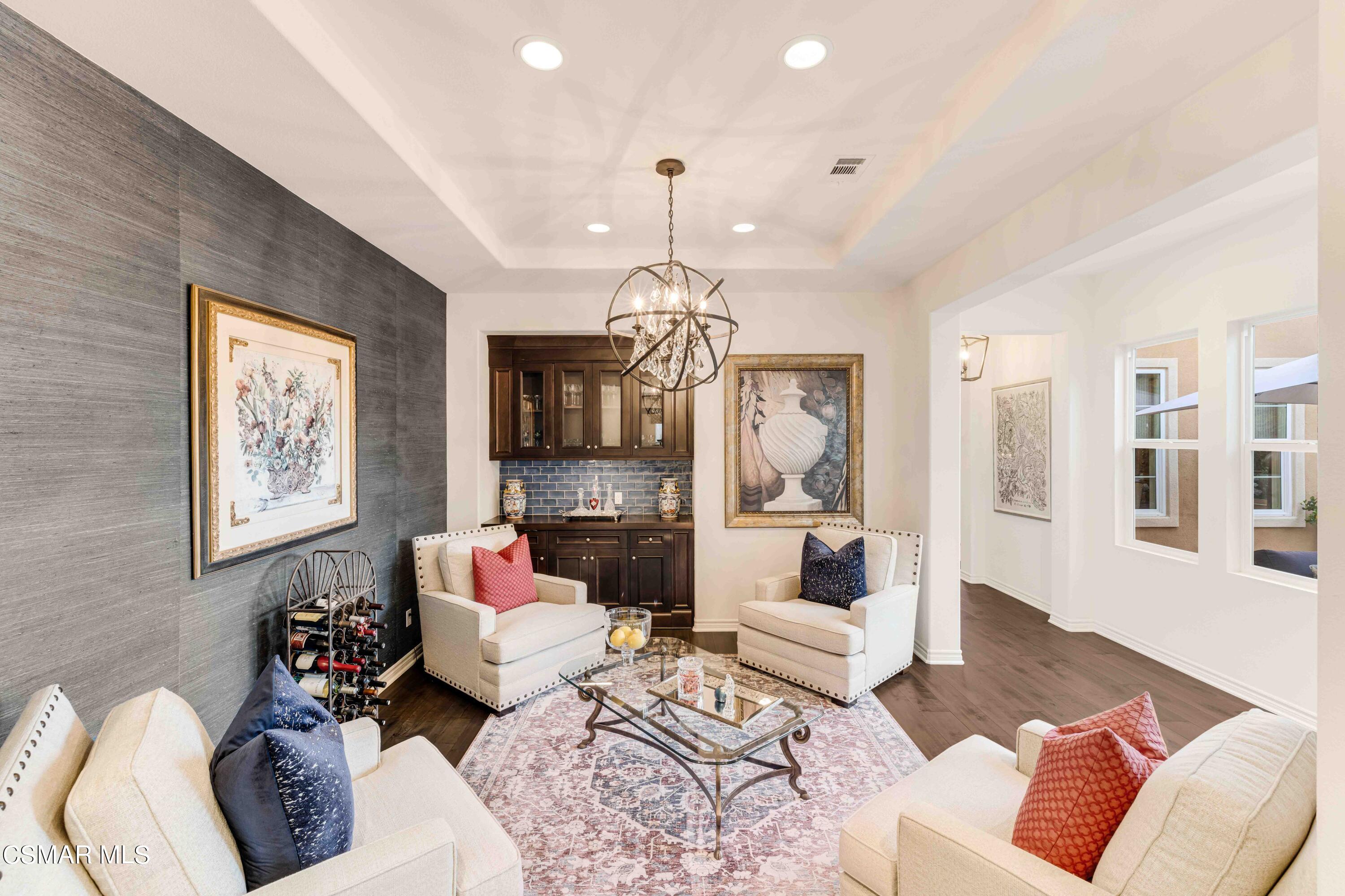 13210 Bent Grass Place Moorpark, CA 93021 - Photo 5 of 73 a living room with furniture and a chandelier