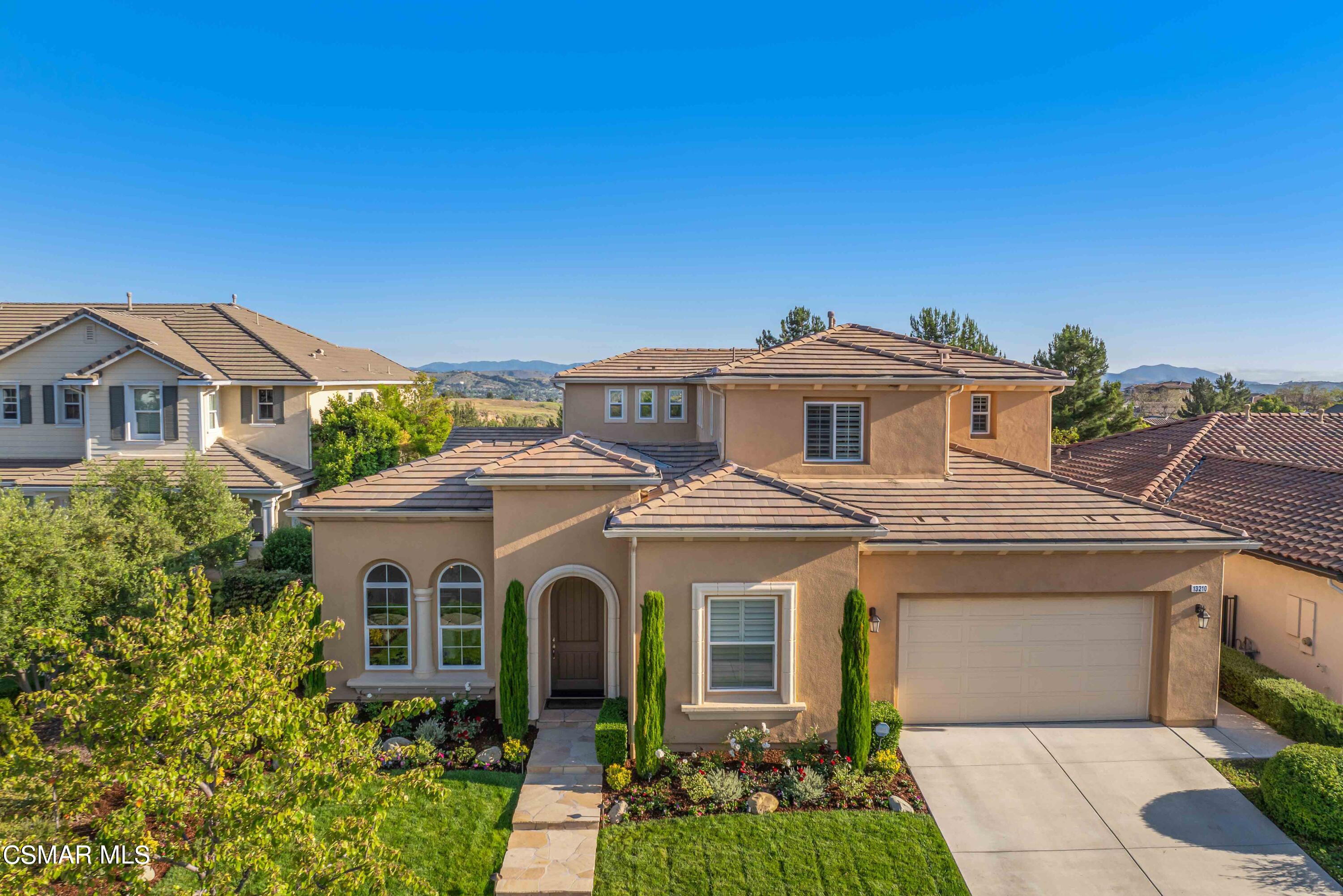 13210 Bent Grass Place Moorpark, CA 93021 - Photo 52 of 73 a front view of a house with a yard