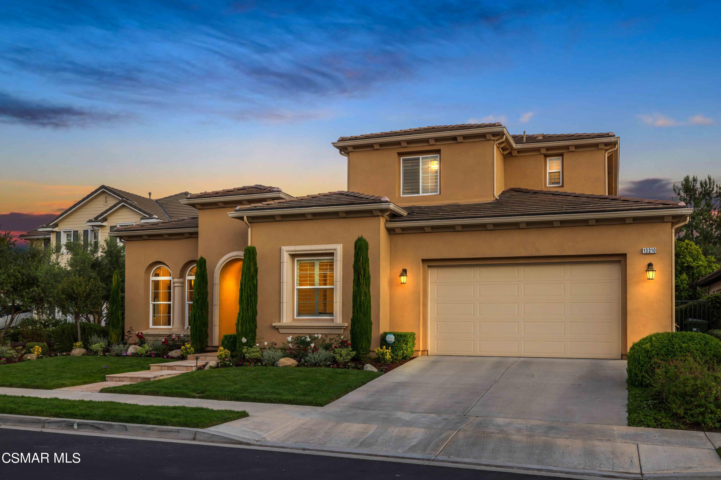 13210 Bent Grass Place Moorpark, CA 93021 - Photo 60 of 73 a front view of a house with a yard and garage