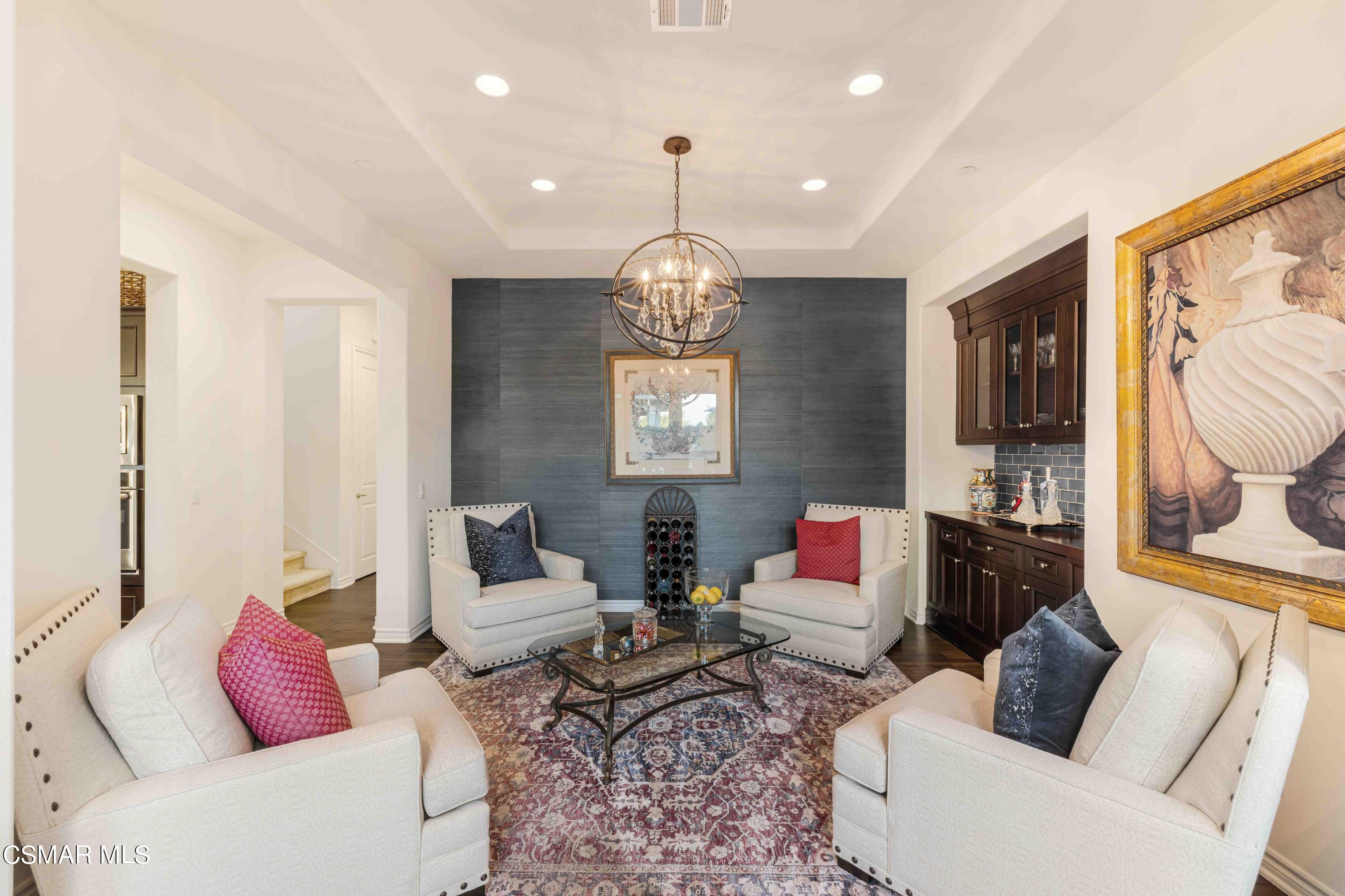 13210 Bent Grass Place Moorpark, CA 93021 - Photo 6 of 73 a living room with furniture a rug and a chandelier